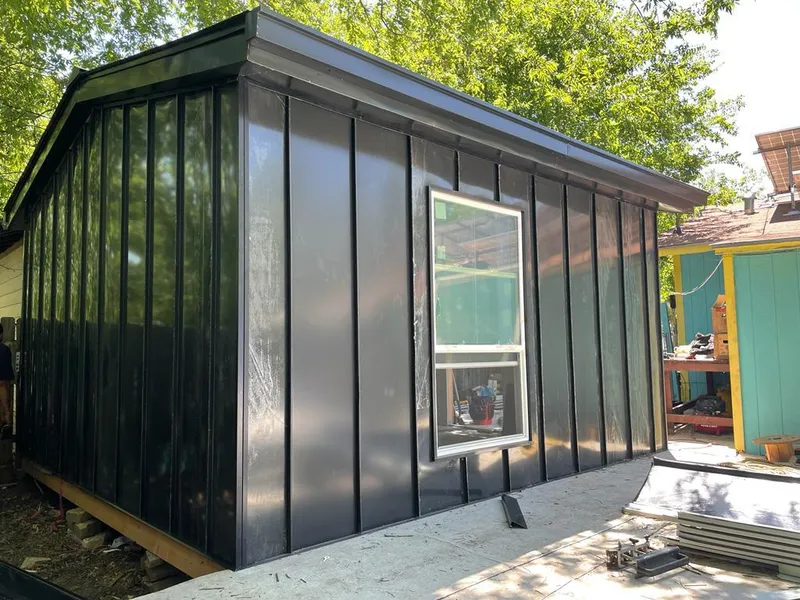 Black standing seam metal wall panels for Roof Inspection in Taylors